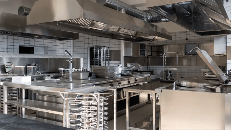 unoccupied stainless steel commercial kitchen 