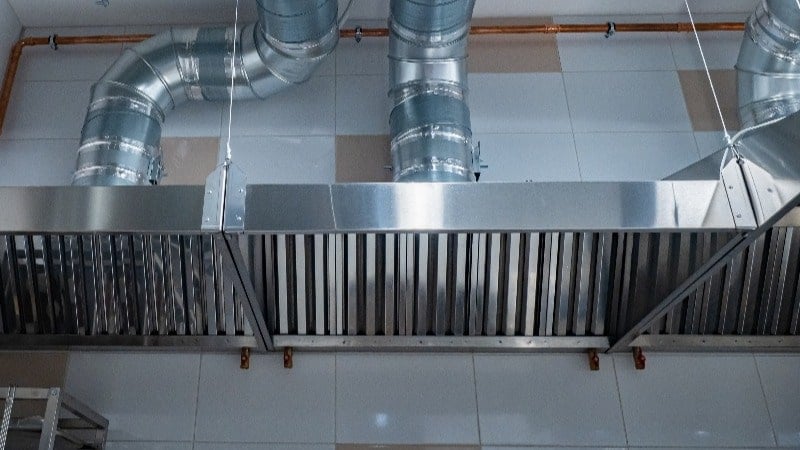 Featured image: Kitchen hood on wall - Read full post: 4 Things You Need To Know About Kitchen Hood Maintenance