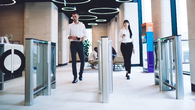 Featured image: People walking through security - Read full post: Common Building Security Vulnerabilities